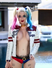 Solo girl Leyla Falcon models next to a pool in a cosplay garment