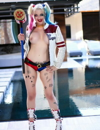 Solo girl Leyla Falcon models next to a pool in a cosplay garment
