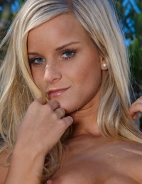 Slim blond model Miela reveals her girl-spit molten body outdoors