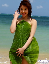 Busty asian babe Adusa Kyono slipping off her bikini outdoor