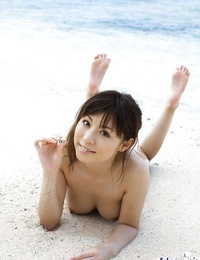 Busty asian stunner with neat ass Aya Hirai gliding off her swimsuit outdoor
