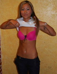 Asian teen babe with tiny tits Tina posing in scorching bikini outdoor