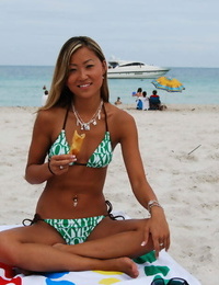 Asian teen babe with tiny tits Tina posing in scorching bikini outdoor