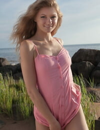 Beach babe Patritcy A revealing tiny teen breasts outdoors for glamour pics