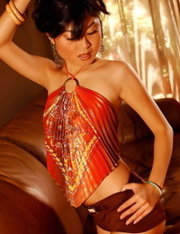 Asian porn industry star Thi Quach demonstrates her tight ballsack in a bikini
