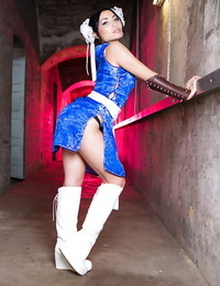 Asian solo lady Lily Love freeing petite knockers from cosplay uniform outdoors