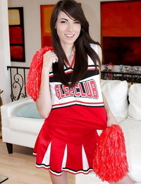 Wild teenage woman Emily Grey posing solo in spectacular cheerleader uniform