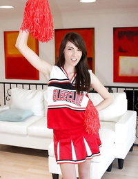 Wild teenage woman Emily Grey posing solo in spectacular cheerleader uniform