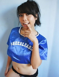 Puny Oriental cheerleader May Lee flashing black subjugation under mini-skirt