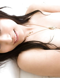 Pretty asian stunner Misaki Mori slipping off her undergarments on the bed