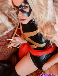 Blonde solo girl Xena Wilkes struts in cosplay fetish garment while smoking