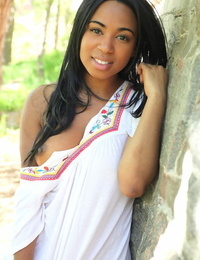 Beautiful black teenager Tahela revealing her dearest breasts and puss outdoors