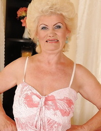 Full-bosomed light-haired granny disrobing and showing her shaggy twat