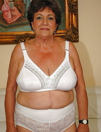 Fatty granny in undergarments gets bare to display her wet pussy