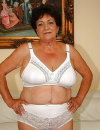 Fatty granny in undergarments gets bare to display her wet pussy