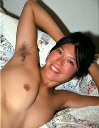 Wannabe Asian model Amanda demonstrates her damp purple undies and hairy armpits
