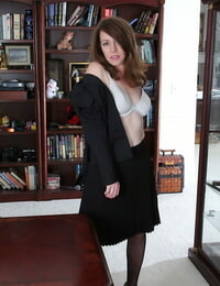 Mummy over 40 Joanie Bishop is a spectacular secretary in pantyhose and miniskirt