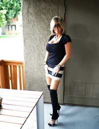 Aged housewife Sandra Otterson posing in over the knee socks for stunner pictures