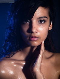 Indian woman demonstrates off her thick natural knockers while modeling in the nude