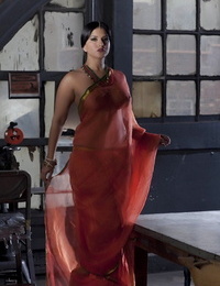 Big-titted solo chick Sunny Leone models solo in observe thru Indian apparel
