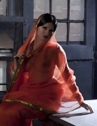 Big-titted solo chick Sunny Leone models solo in observe thru Indian apparel