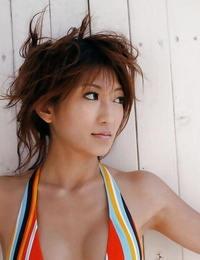 Stunning asian teenage girl Yu Satome slipping off her bikini