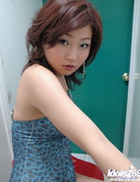 Diminutive asian hotty with puffy knockers taking off her top and undies