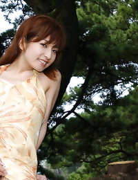 Nasty asian cutie An Nanba slipping off her dress outdoor