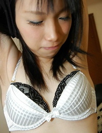 Lovely asian stunner Chiharu Moriya getting naked and caressing her love button