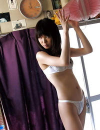 Slim asian babe with neat ass stripping off all of her clothes
