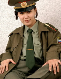 Korean inexperienced Elena undressing off military uniform to pose naked