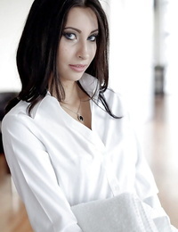 Dickblowers honey Jade Jantzen posing entirely dressed in white half-shirt and miniskirt