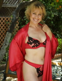 Sassy mature blonde Rachael Rains gets rid of her lingerie top