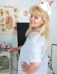 Salacious granny in nurse uniform revealing her rack and soaking humid pussy
