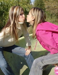 Teen lesbians head to a public park to masterfully their knockers and bums