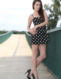 Solo girl eliminates her polka dot sundress while out for a walk in public