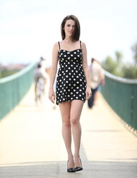 Solo girl eliminates her polka dot sundress while out for a walk in public