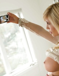 Lovely teenage ash-blonde Tasha Reign is making some self shots on webcam