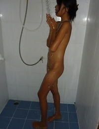 Thai teenage Dow wetting her flat chest and taut little ass in shower