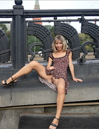 Pretty blonde flashes naked upskirt in a realm small naked tits in the city