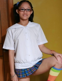 Slurps Asian teenage slips off her upskirt lingerie in multi-colored knee socks