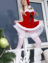 Nice teenager Agata showcases her firm knockers and tight images in Christmas outfit